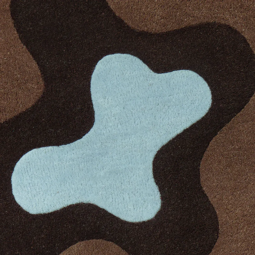 Modern Mocha Tide Rug with organic ripple pattern blending mocha, chocolate, and sky blue shades