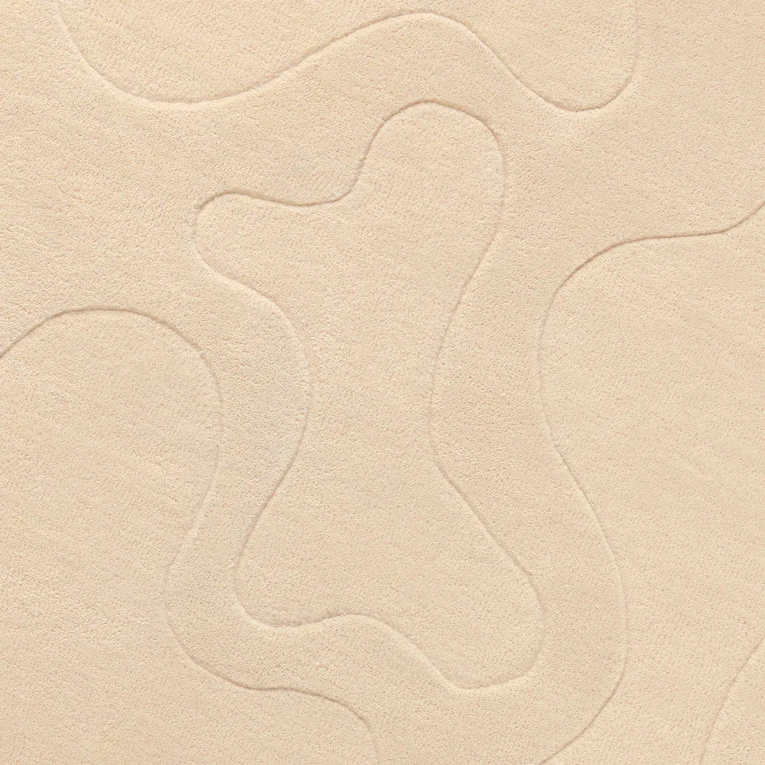 Elegant beige area rug with subtle embossed abstract pattern – Nude Muse handmade rug