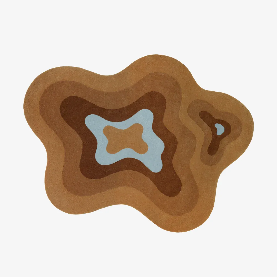 Terra Ripple Rug Terra Ripple Rug featuring layered wave design in warm brown and blue tones – handmade tufted rug by Sneagear