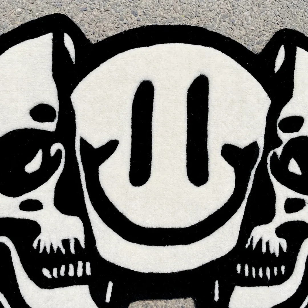 Modern art rug with abstract skull and smiley face blend – Twin Reaper hand-tufted rug for edgy interiors