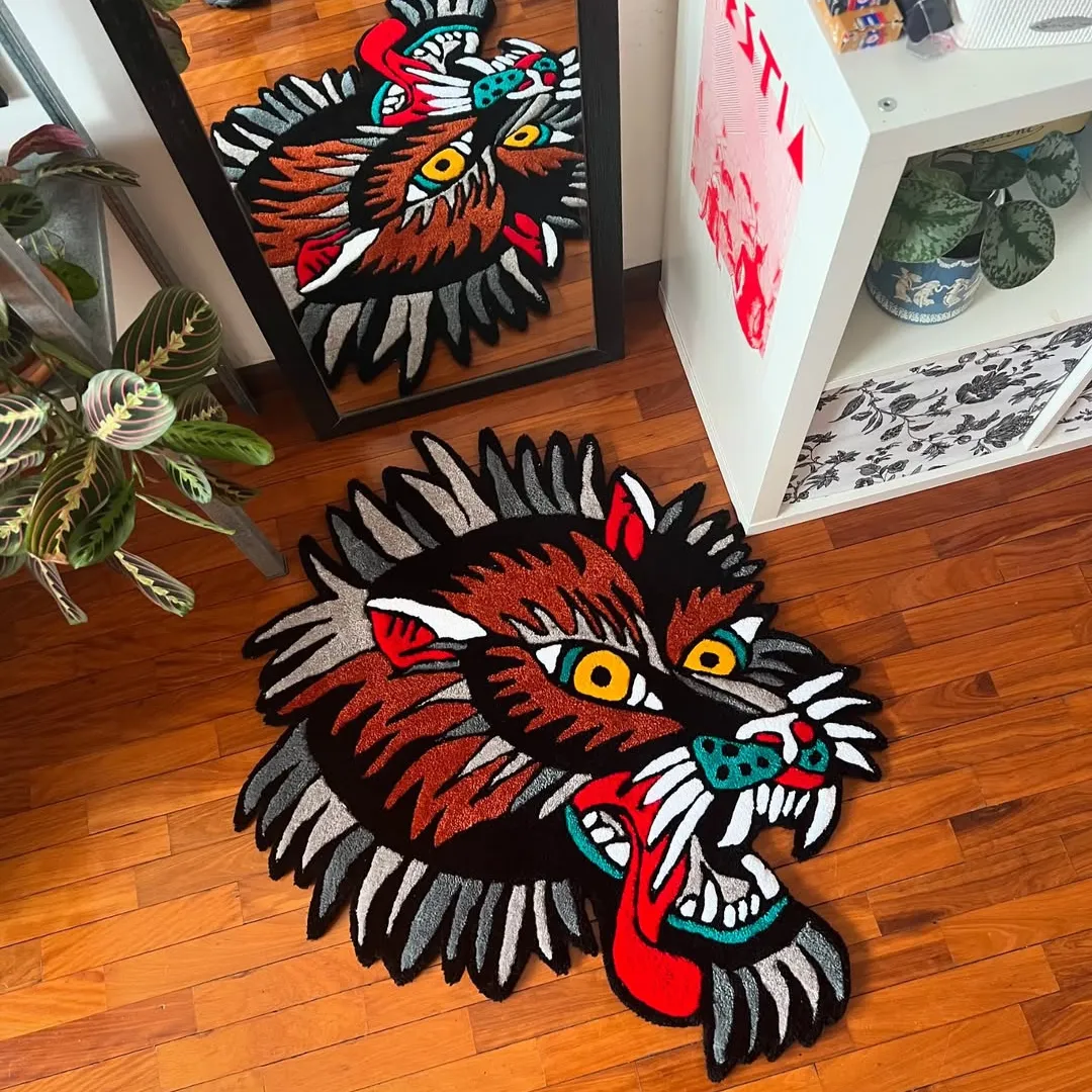 Wild Howl Rug featuring fierce wolf face design with red tongue and yellow eyes – hand-tufted rug by Sneagear