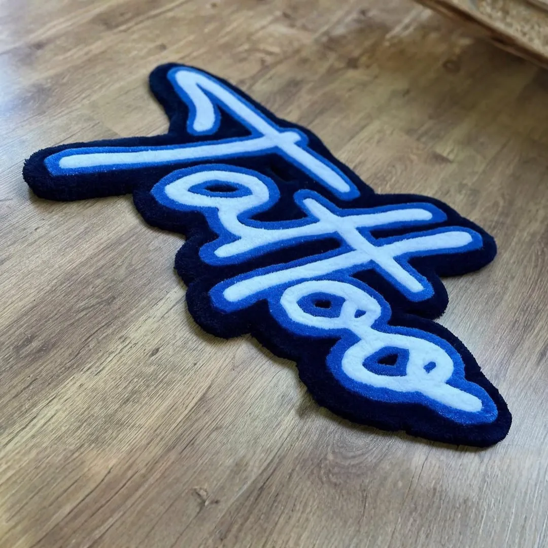 Arctic Rug Arctic Script Rug featuring cool blue tattoo lettering design – handmade wool rug by Sneagear
