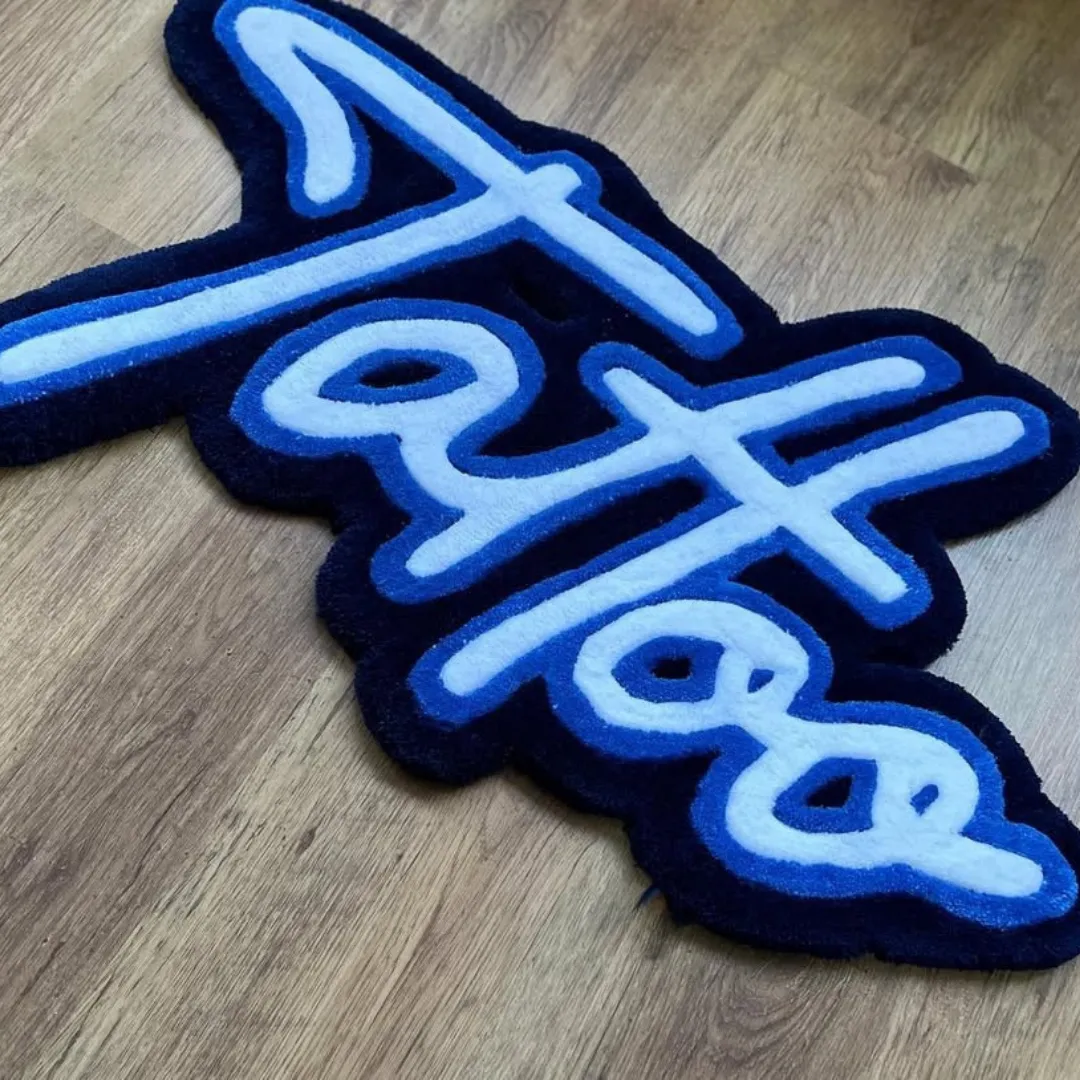 Arctic Script Rug Tattoo-style rug with flowing script design in blue and navy – Arctic Script Rug
