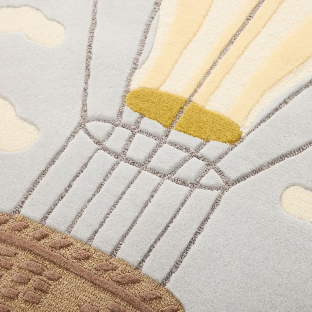 Handmade Cloud Dancer Rug with floating balloon and sky pattern – whimsical kids room rug