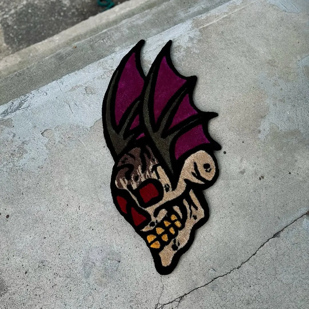 Tattoo-style rug with crimson-eyed skull and purple bat wings – Crimson Mirage Rug