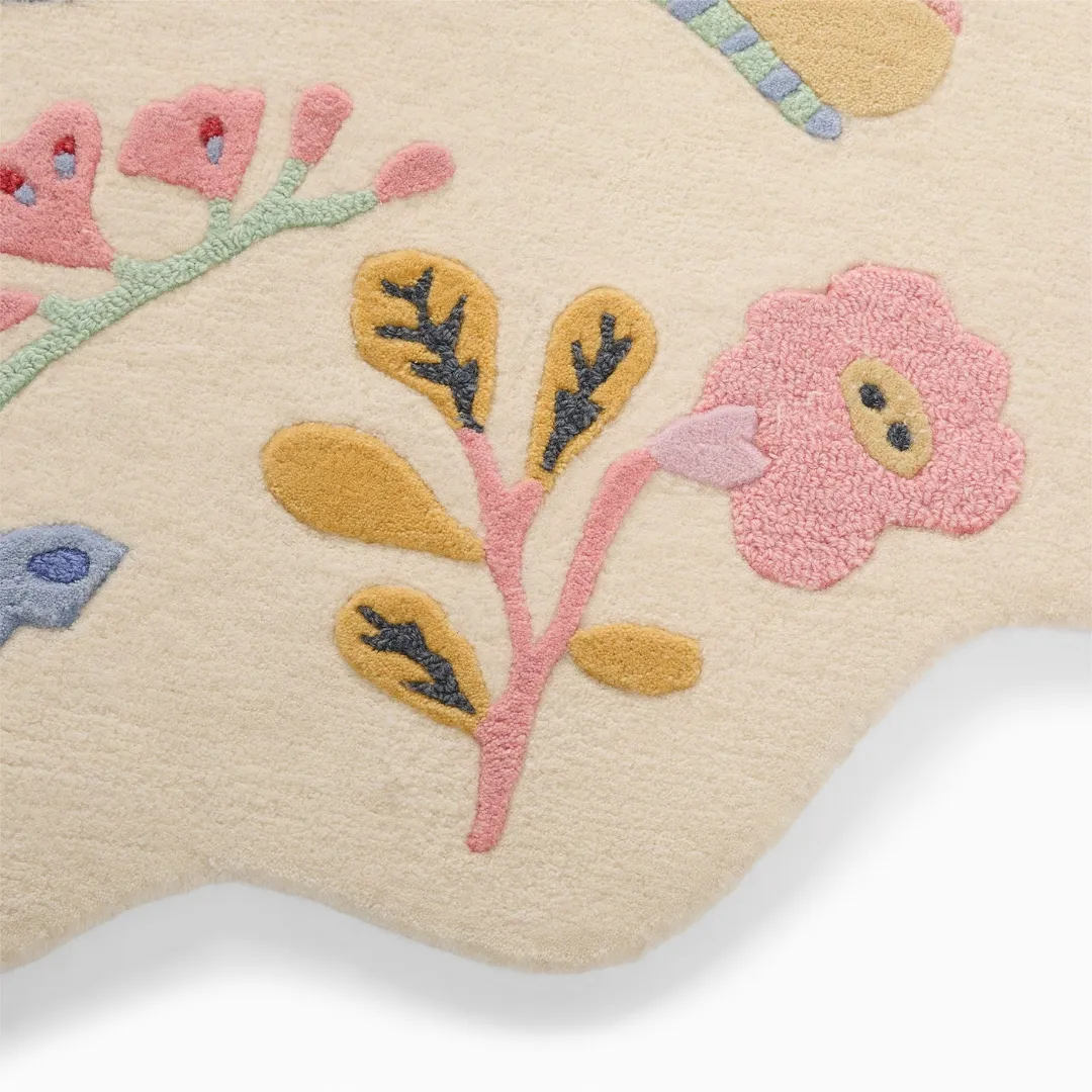 Whimsical hand-tufted rug in cream with embroidered flowers and insects – Honey Lull Meadow design