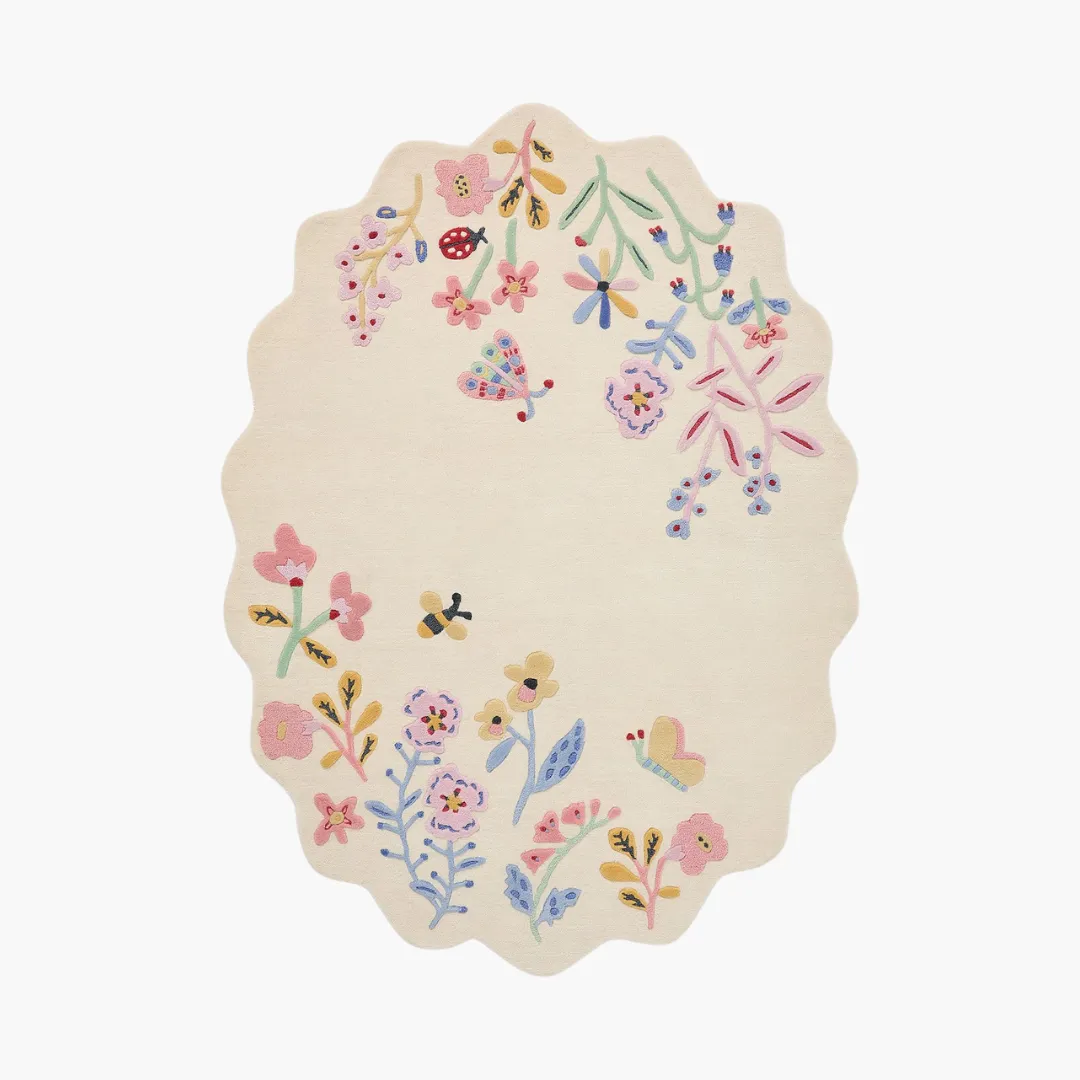 Honey Lull Meadow Rug featuring pastel floral embroidery and playful bees – hand-tufted oval rug by Sneagear