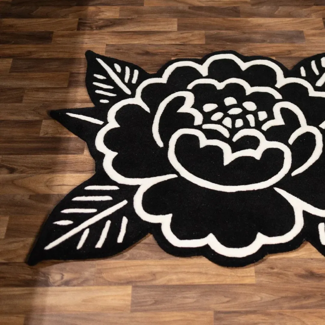 Handmade wool rug with black and ivory flower shape – Midnight Bloom Rug