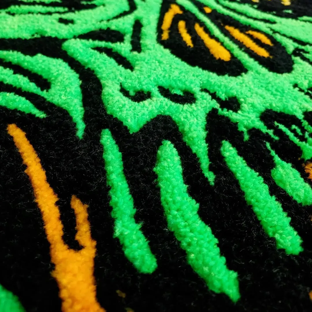 Handmade Neon Rot Rug with glowing green skull design and orange detailing – gothic statement rug