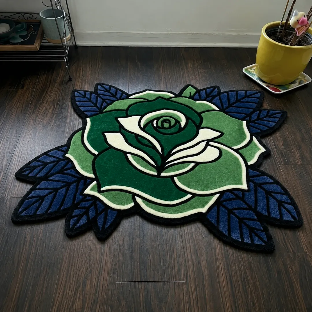 sage thorne rug angle view Angle view of the handmade Sage Thorne tufted rug showcasing its unique floral contours and rich green and blue tones.