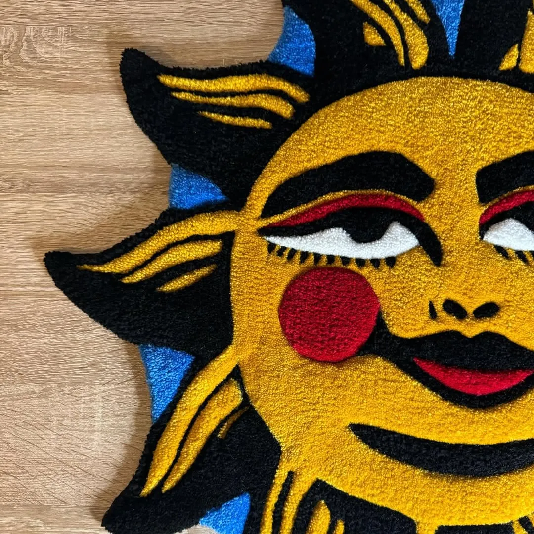 Tattoo-style rug with smiling sun motif in yellow, red, and black – Solar Smile Rug