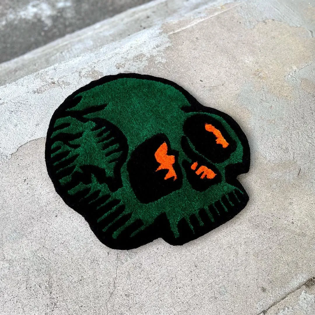 Tattoo-inspired green skull rug with bold orange details – Verdant Skull Rug