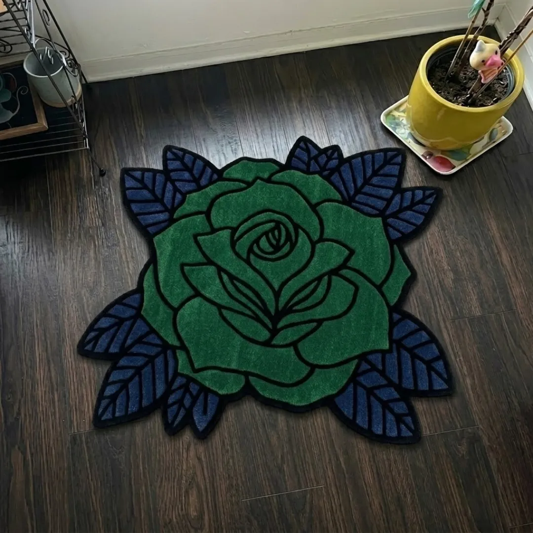 Angle view of the handmade Verdant Thorne tufted rug showcasing its unique floral contours and bold design on a wooden floor.