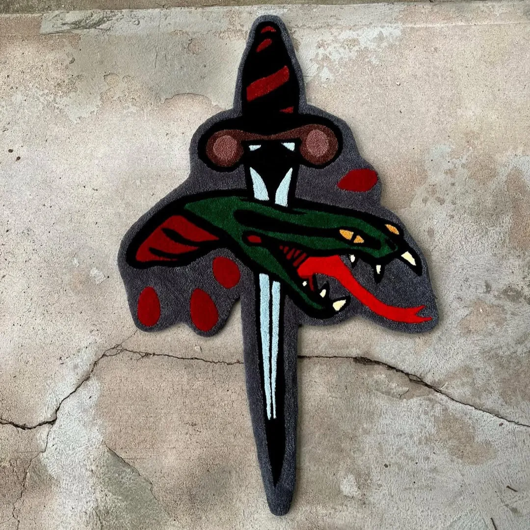 Tattoo-style rug with dagger piercing viper design in green and red – Viper Pierce Rug