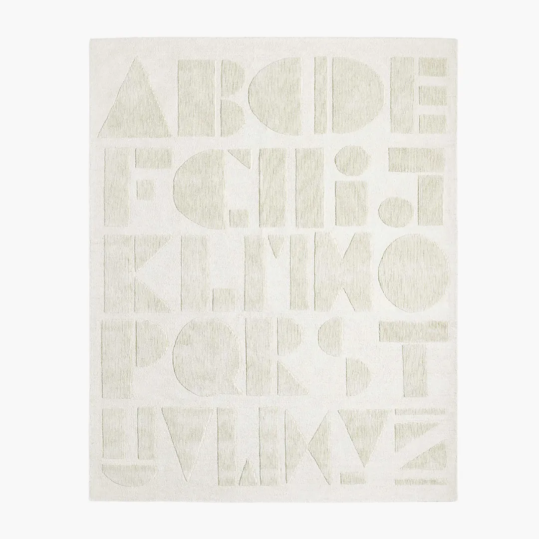 Whisper Script Rug featuring soft tonal alphabet design in ivory and beige – hand-tufted wool rug by Sneagear