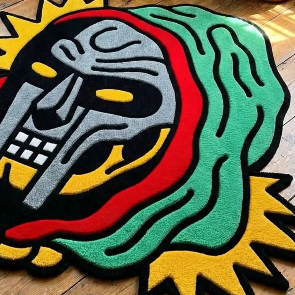 Detailed perspective of the Graffiti Deity rug highlighting the artistic green hood and yellow spiked edges.