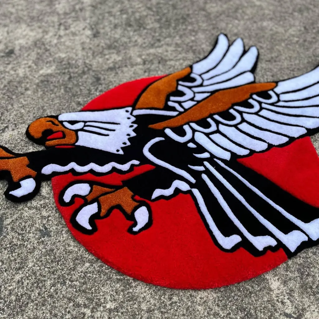 Silent Wings Rug Traditional Tattoo Style Texture Close up angled perspective of the Silent Wings rug showing the plush wool texture of the eagle wings and talons.