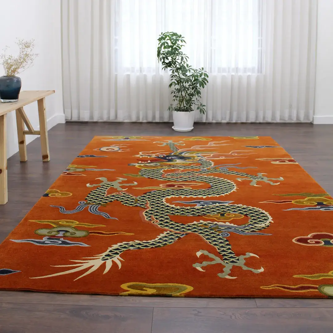 The Ember Rise rug styled in a bright room with white curtains, displaying the full length of the oriental dragon motif as a statement piece for a living area.