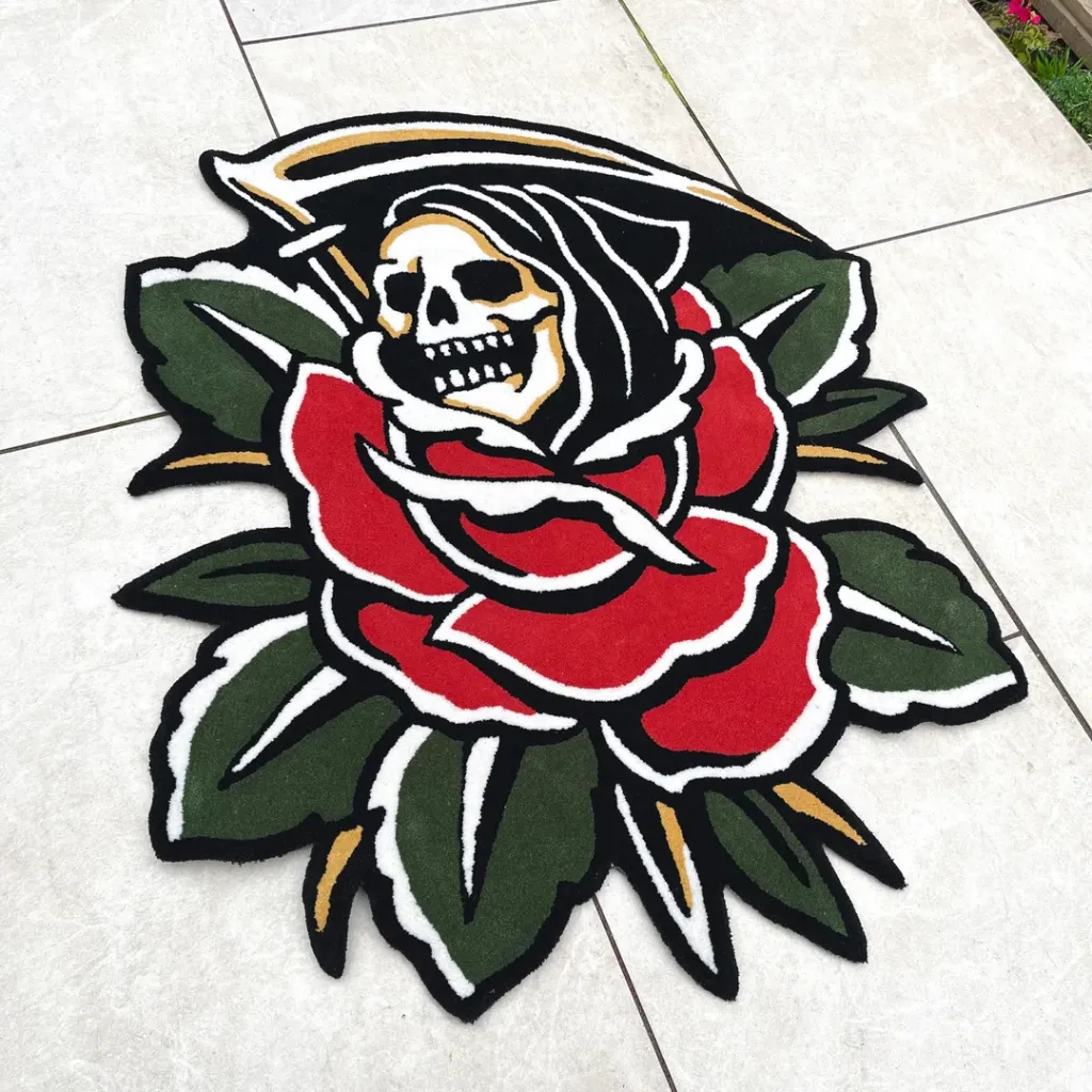 Hand Tufted Reaper Rose Custom Rug The Blooming Reaper Traditional rug laid on a tiled floor, showcasing the intricate details of the scythe and green leaves in a classic American tattoo style.