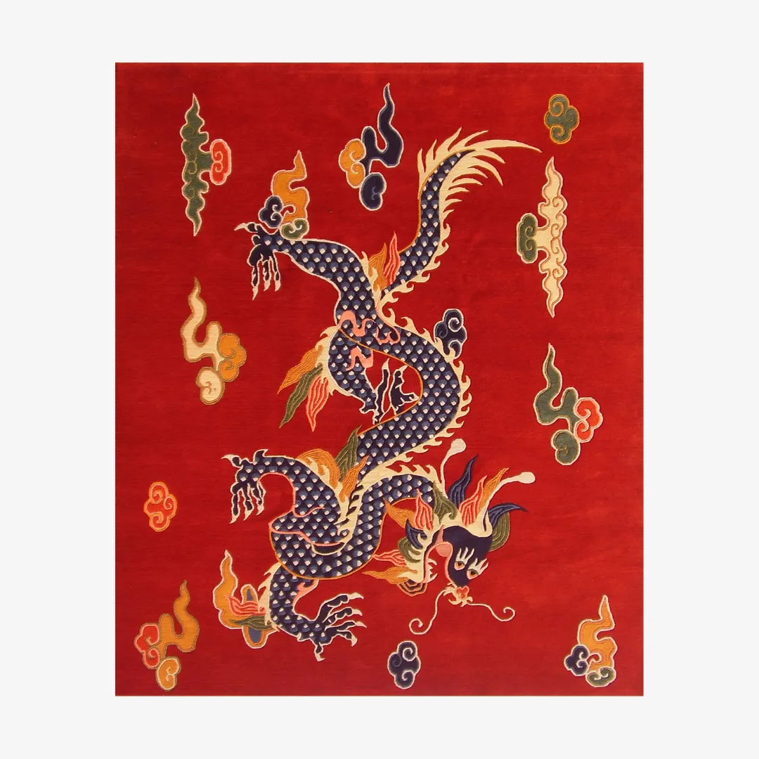 Top down view of the Imperial Flame rug, showcasing the detailed hand-tufted wool construction and the central Chinese-style dragon illustration in blue, orange, and green on a rich red field.