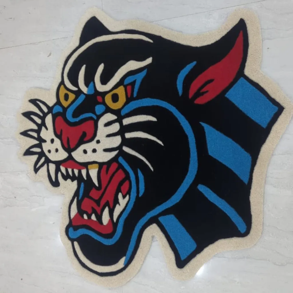 Top down view of the Night Howler Inked Rug, highlighting the custom die-cut shape and the classic "American Traditional" tattoo aesthetic of the snarling panther.