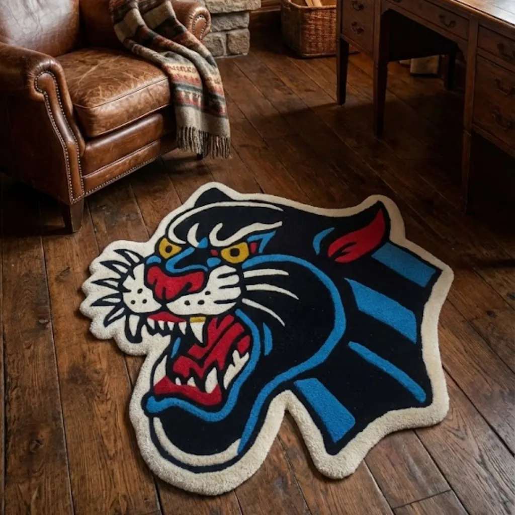 Angled view of the Night Howler Inked Rug placed on a wooden floor near a leather armchair, featuring a bold traditional tattoo-style roaring black panther design.