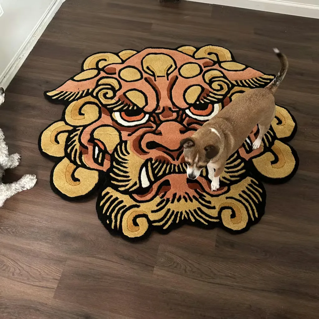 orange foo dog rug size reference High angle shot of the Orange Foo Dog rug with two dogs standing nearby, providing a size reference for this unique oriental decor piece.