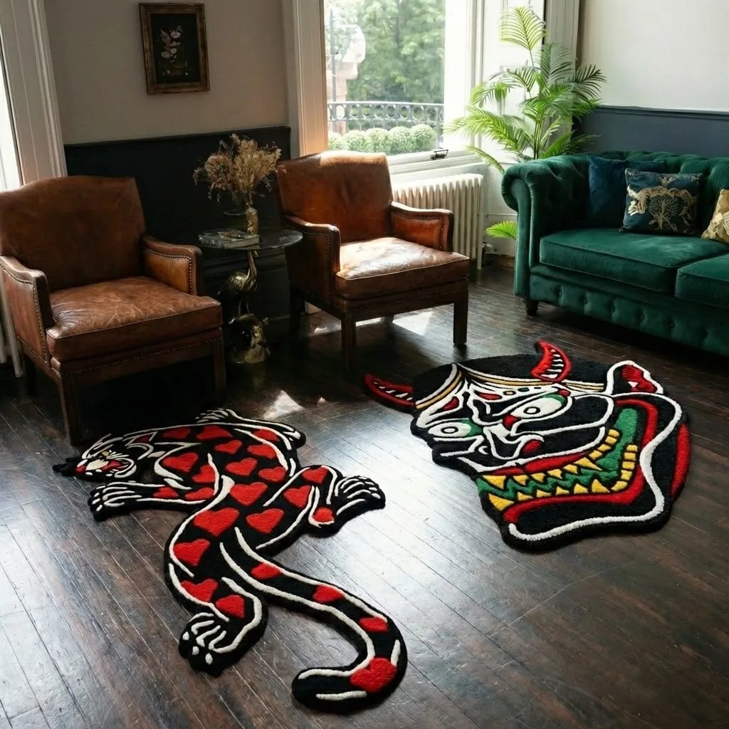 High angle view of the full Amour Panther rug placed on a rustic wooden floor, showcasing the classic panther skin shape reimagined with a soft pink background and heavy black tattoo-style contours.