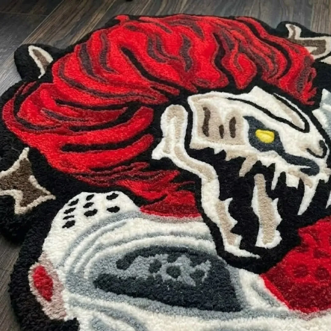 crimson talon break rug close up texture Close-up of the detailed tufted pile texture, skull graphic, and vibrant red and white design on the Crimson Talon Break rug.
