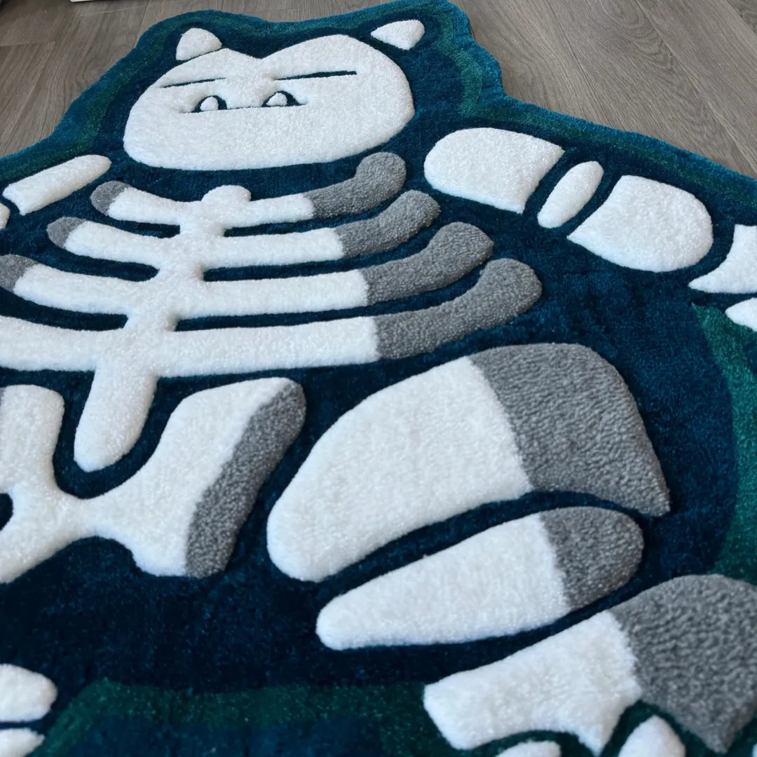 Angled view of the Lazy Lax rug highlighting the 3D hand-carved details of the rib cage and bones against a plush teal background.