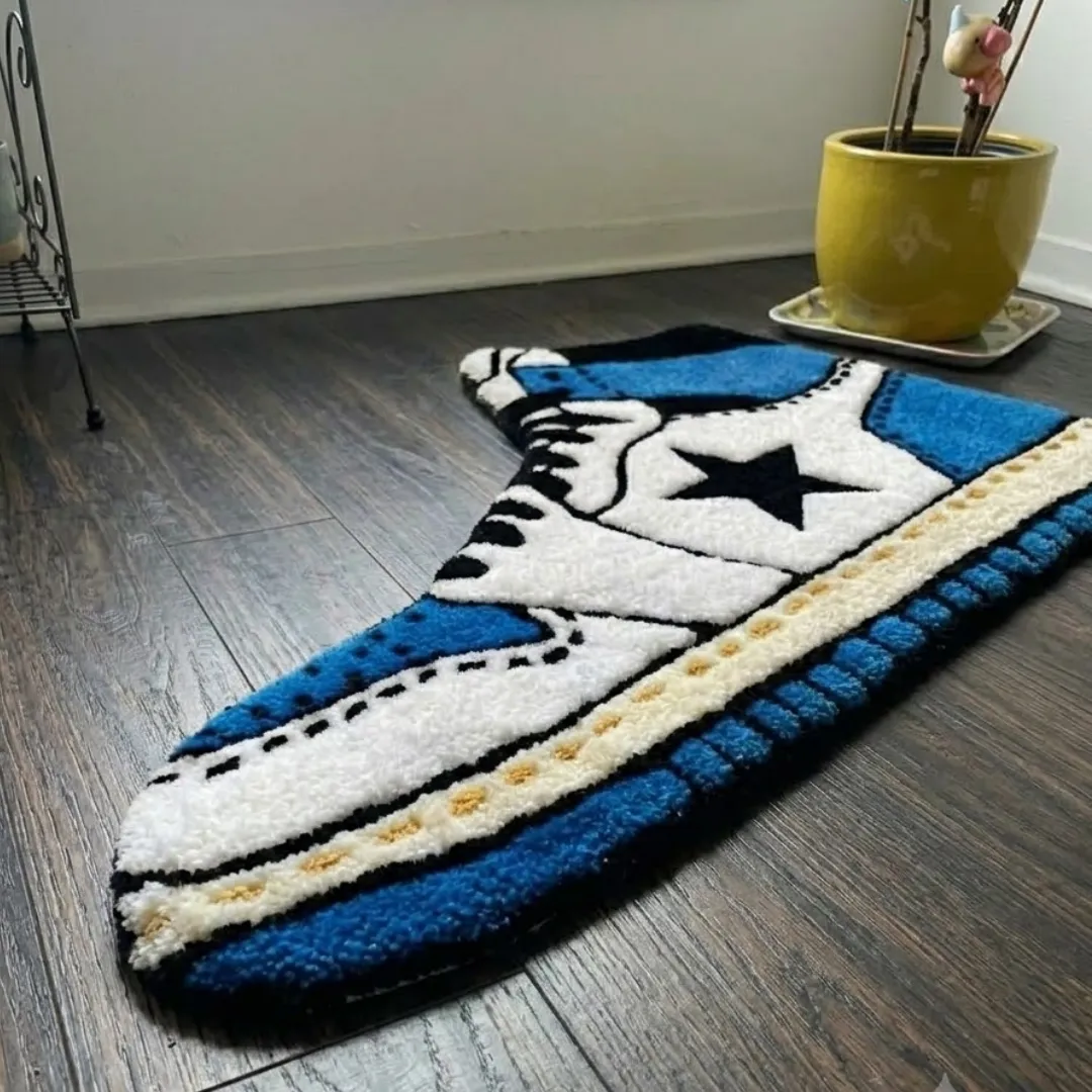 Angle view of the handmade Sapphire Flowstate tufted rug showcasing its unique contours and texture.