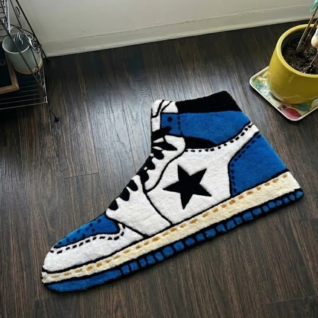 Sapphire Flowstate sneaker shaped tufted area rug displayed flat on a dark wooden floor.