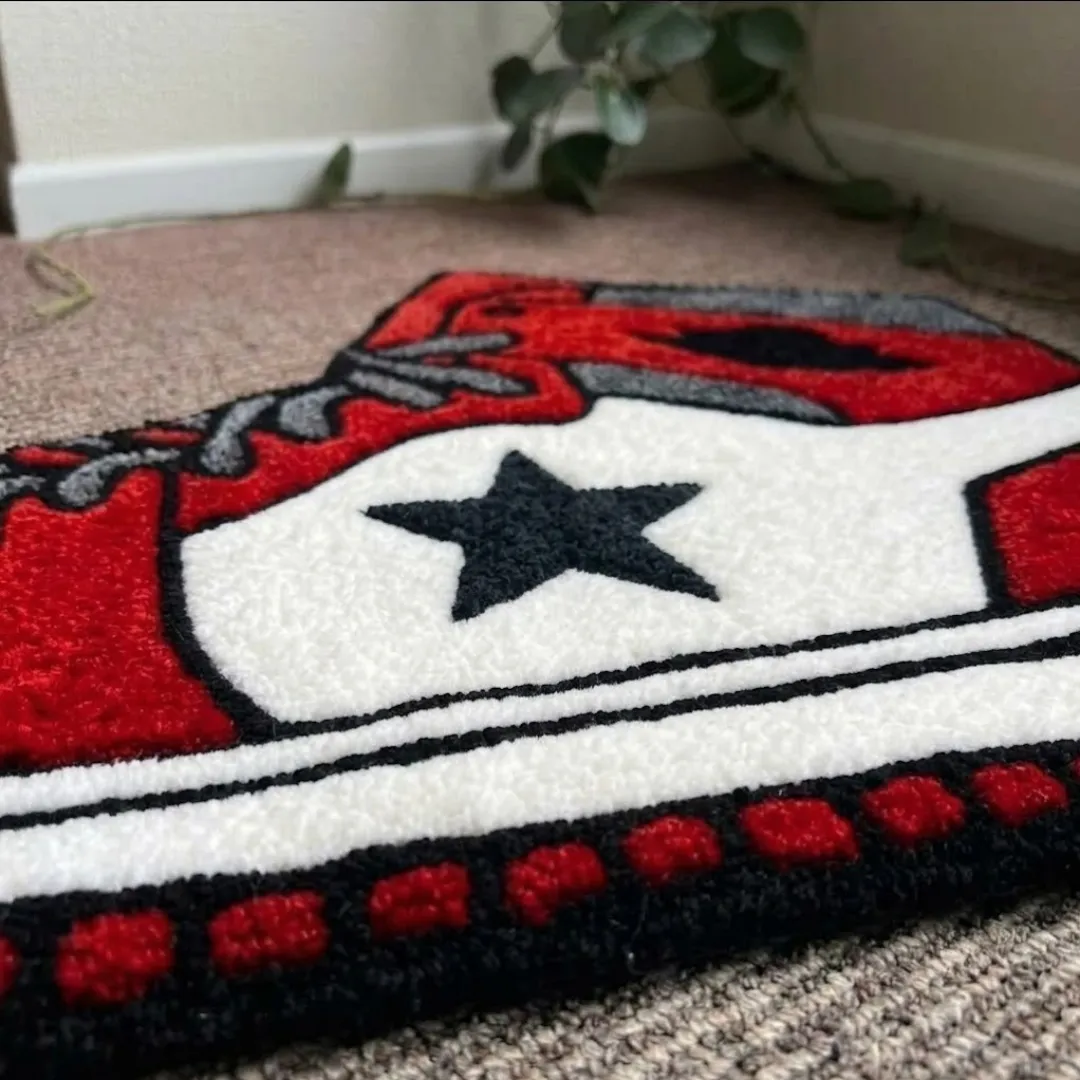 scarlet court step rug close up texture Close-up of the detailed tufted pile texture, black star design, and red and white color blocking on the Scarlet Court Step rug.