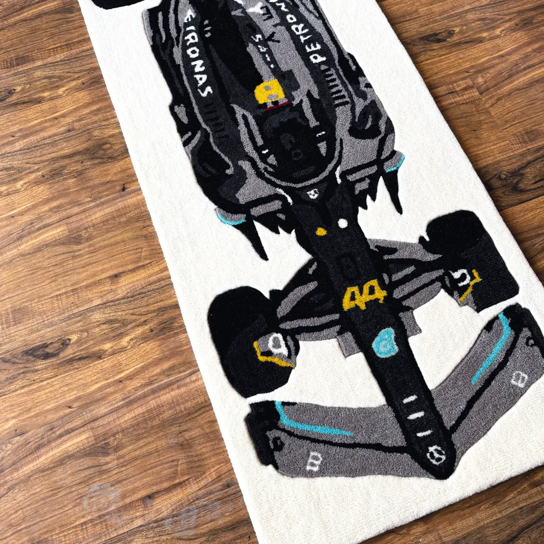 High angle view of the Scarlet Pulse rug showcasing the sleek aerodynamic shape of the F1 car design, accented by a red airbox detail and teal wing tips.