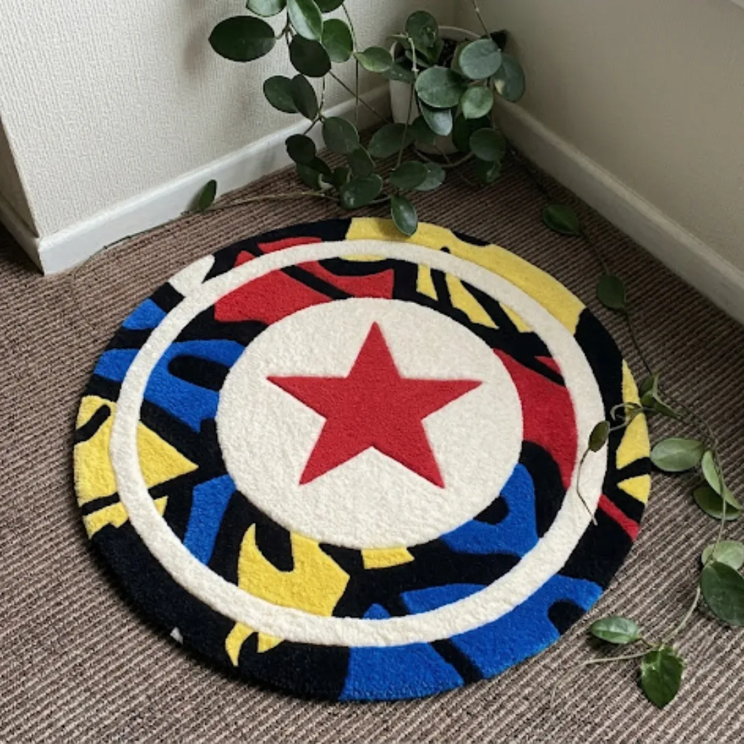 Spectrum Kickmark round tufted area rug displayed flat on a carpeted floor.