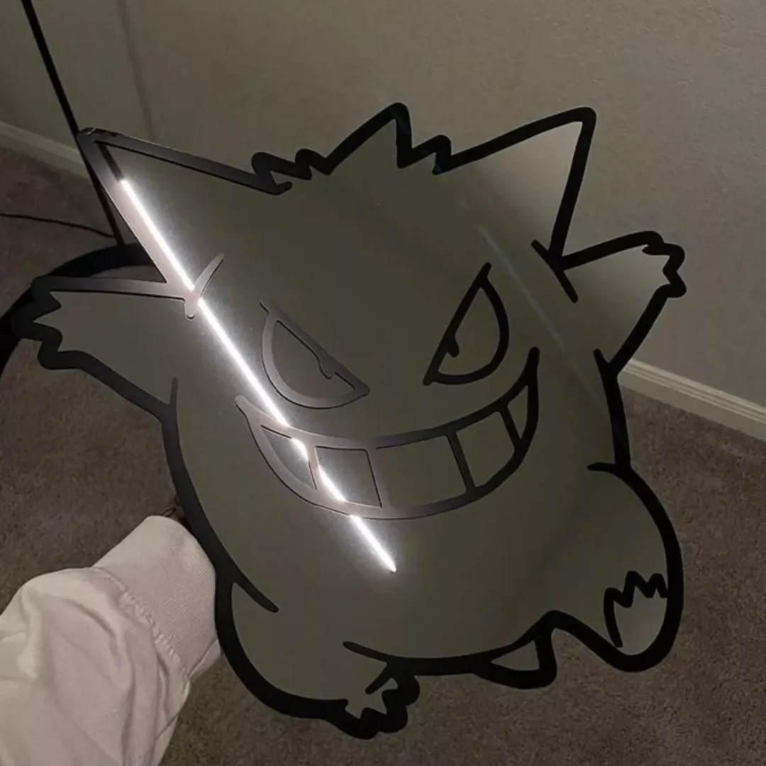 Close-up, angled view of the Spooky Ghost Mirror, focusing on the cute white ghost decal and reflecting bright light, showcasing the smooth glass surface.