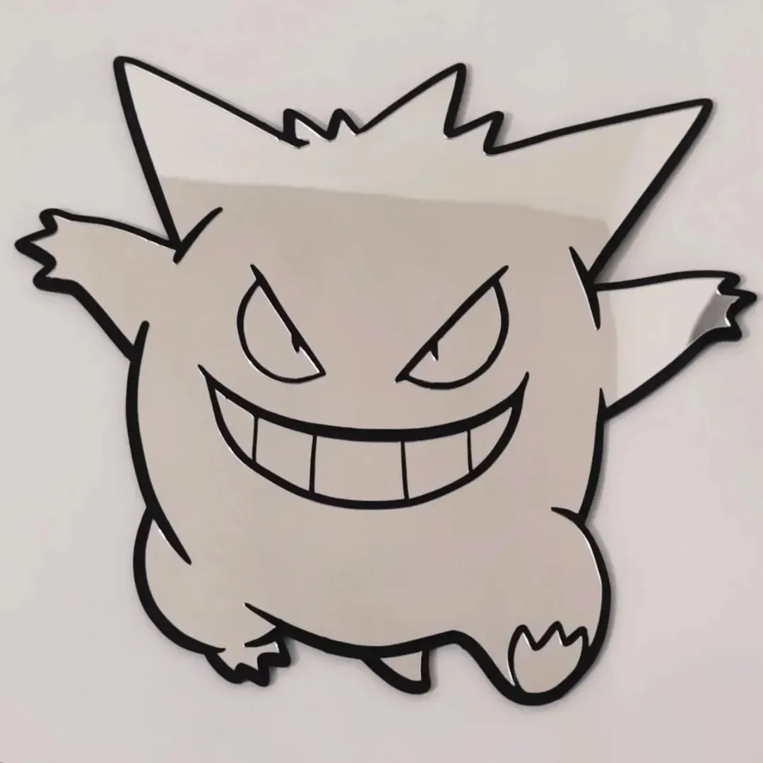 A handheld photo of the circular Spooky Ghost Mirror, showing a hand holding it and reflecting a bright room with white furniture.