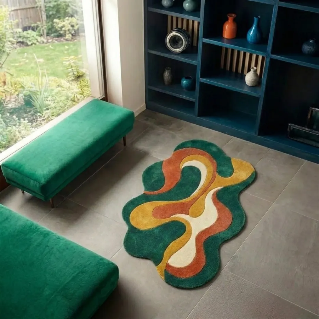 High-angle lifestyle view of the Viral Wave rug showcasing its plush hand-tufted texture and unique irregular shape in a sunlit interior with a modern shelving unit and garden view.