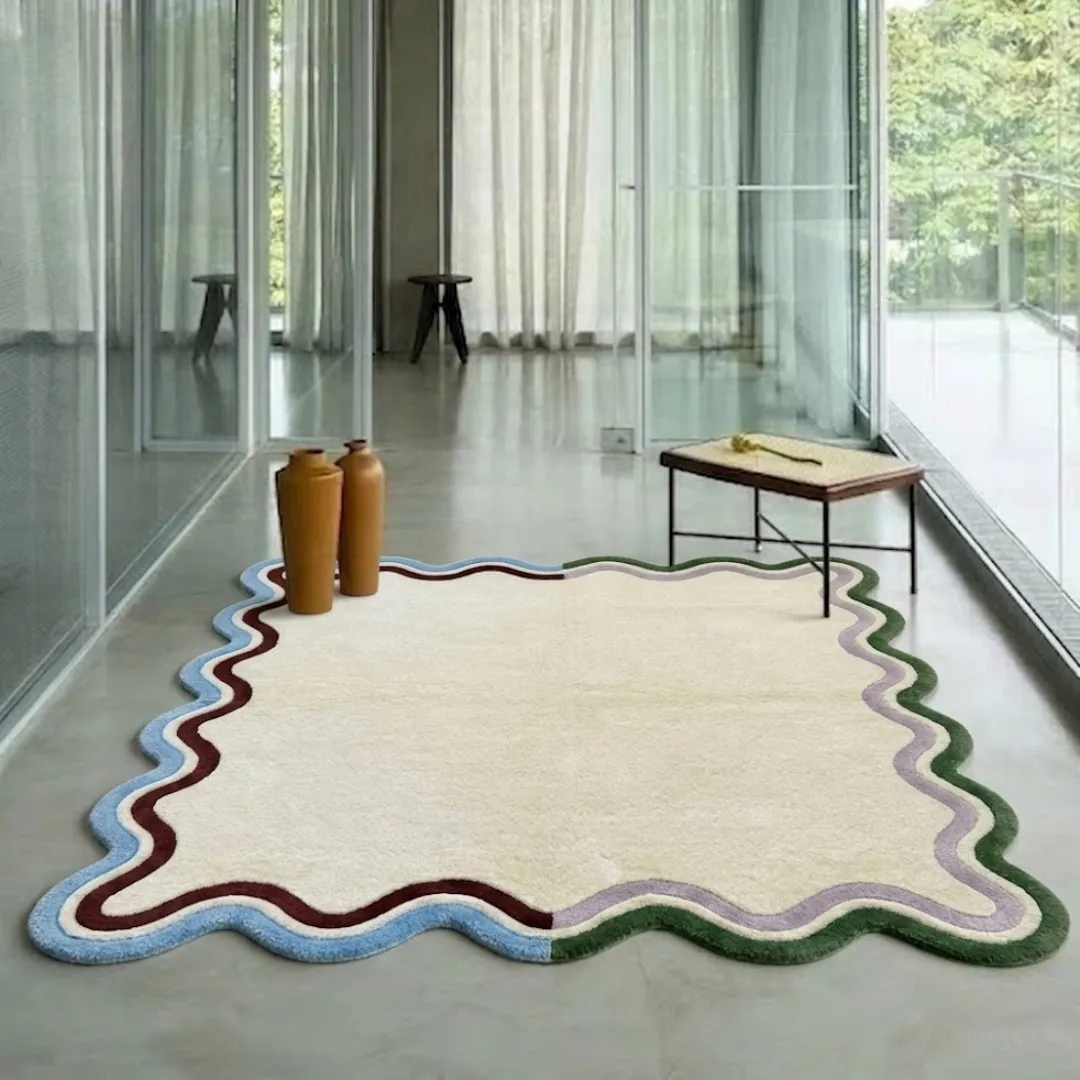 serena scalloped edge rug interior hallway styling An interior lifestyle shot of the Serena rectangular rug with unique wavy scalloped edges, styled on light hardwood flooring in a modern, sunlit hallway.