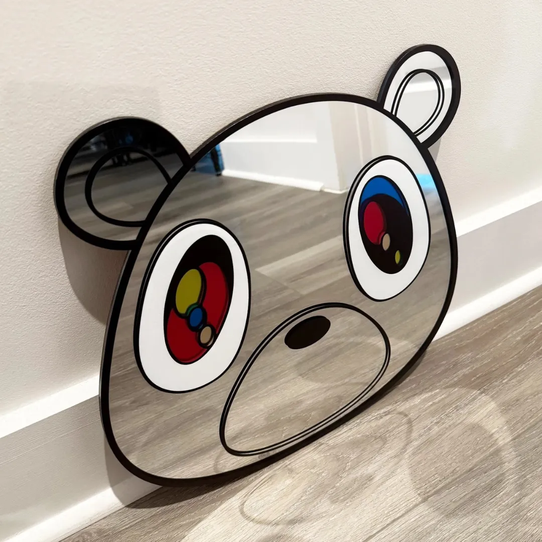 bear dropout rug room mockup Bear Dropout novelty character wall mirror leaning against a neutral wall over a wooden floor.