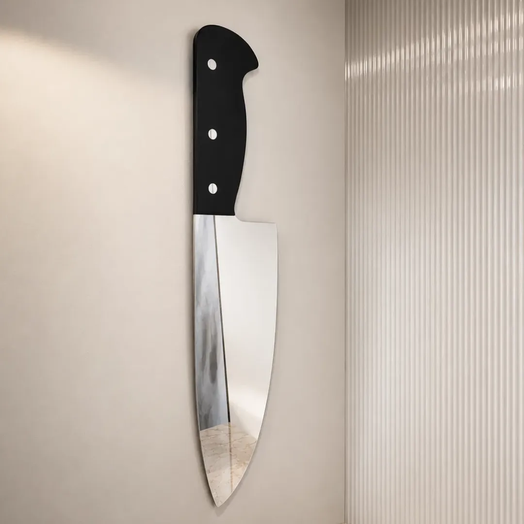 chef knife mirror wall view Chef Knife decorative wall mirror shaped like a kitchen knife with a black handle, mounted vertically on a neutral wall.