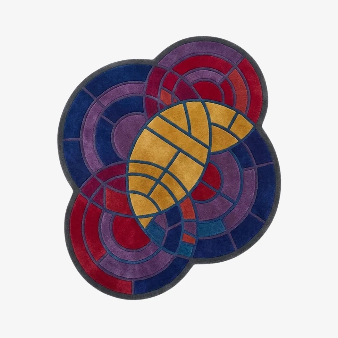 cosmic palette rug top view Cosmic Palette organic abstract tufted area rug featuring vibrant geometric circular patterns in blue, purple, red, and yellow, displayed flat.