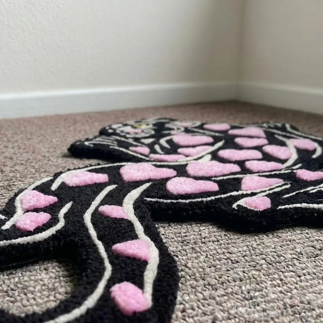 heart panther rug close up texture Close-up of the plush tufted pile texture, carved contours, and pink heart markings on the Heart Panther designer rug.
