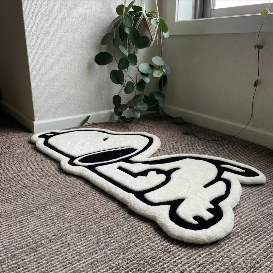 Angle view of the Nuvello Pup tufted rug showcasing its plush texture, carved outlines, and playful character shape.