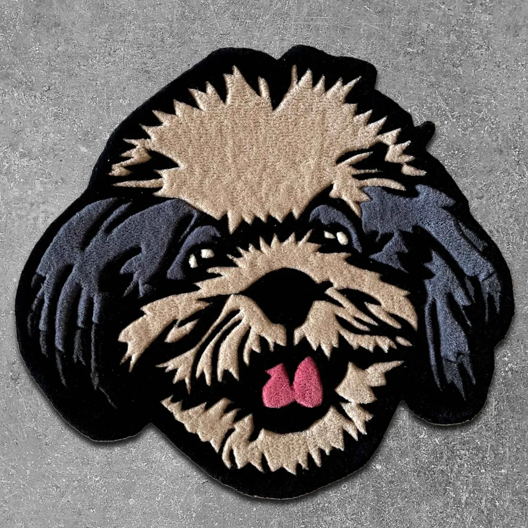 Shadow Poodle handmade tufted area rug featuring a playful cartoon dog face with black, tan, and grey details, displayed flat.