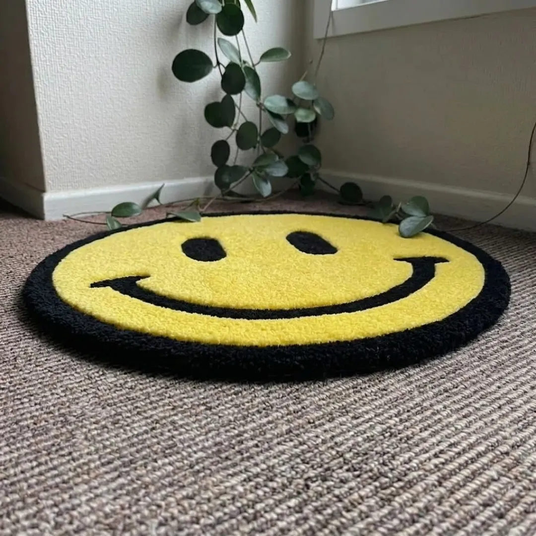 solvani smile rug angle view Angle view of the Solvani Smile tufted circular rug showcasing its plush texture and vibrant yellow color palette.