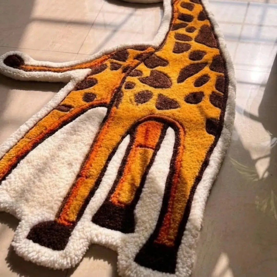 Angle view of the Tallie Jive tufted novelty rug showcasing its unique giraffe silhouette, plush wool pile, and carved details.
