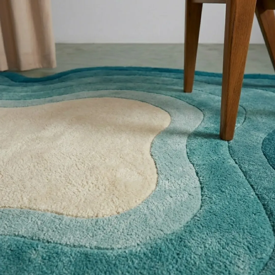tidal ombre rug close up texture Close-up of the plush tufted pile texture, flowing ocean blue gradient layers, and cream center on the Tidal Ombre rug.