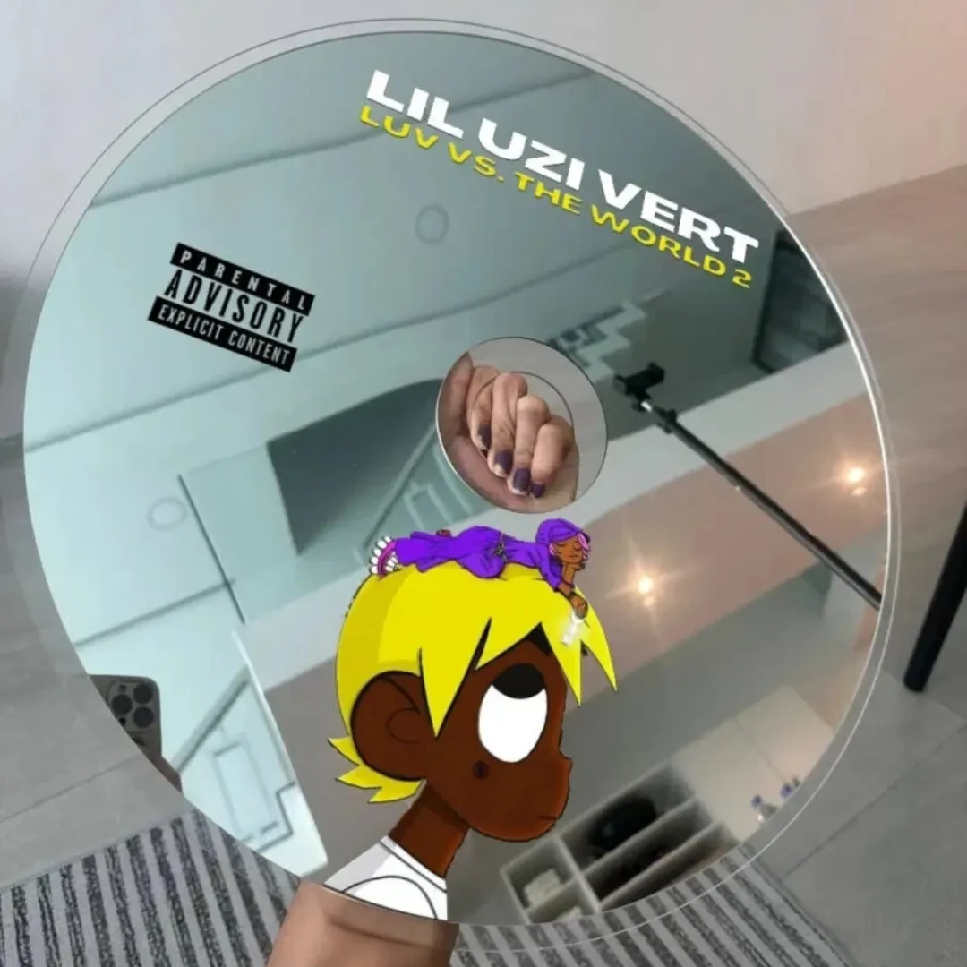 Uzi Disc novelty music CD wall mirror featuring cartoon character graphics and a parental advisory label, reflecting an indoor room setting.
