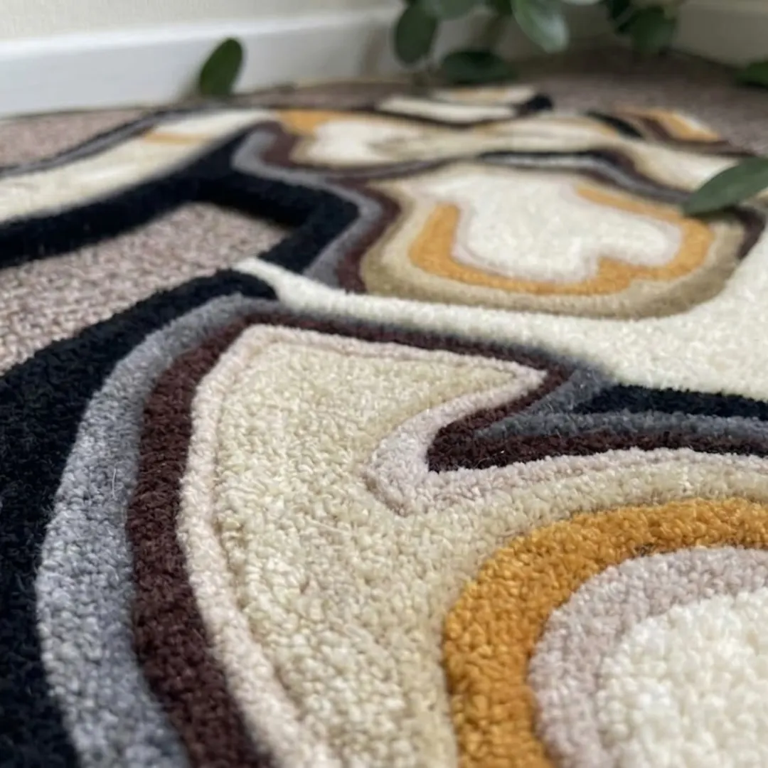 velora rug close up texture Close-up of the plush tufted pile texture, carved contours, and layered yarn details on the Velora designer rug.